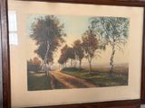 two framed pictures of a farm scene with a road and trees