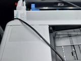 a printer that is sitting on top of a desk