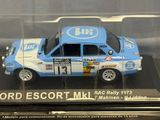 a blue and white car in a clear display case