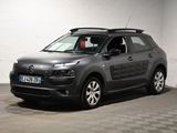 La Citroën grise est garée dans un garage au sol carrelé