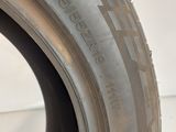 a close up of a tire on a white surface