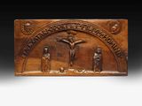 a wooden plaque depicting the crucifix of jesus on the cross