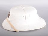 a white hat with a brown ribbon on it