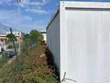 a fence that is next to a building and a fence
