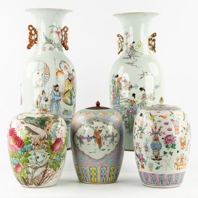 four vases with different designs on them sitting next to each other