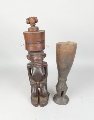 pair of african carved wooden figurines of a man and a woman