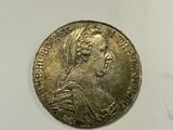 a close up of a coin with a woman ' s face on it