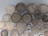 a lot of coins that are on the table