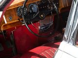 a white car with a red leather seat and dashboard