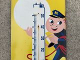 a thermometer with a picture of a boy on it