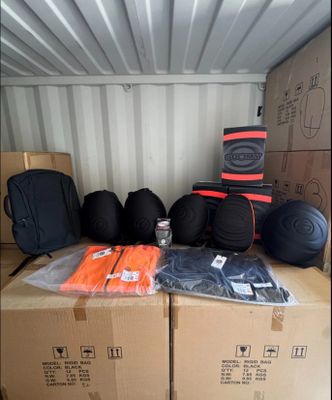many bags of luggage sitting on top of a box