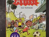 a book with a picture of a boy kicking a soccer ball