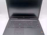a close up of a laptop computer on a white surface