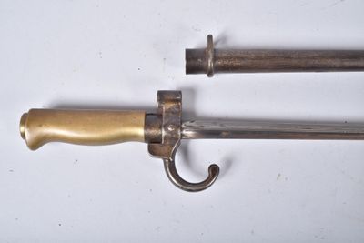 pair of antique brass - plated swords with wooden handles