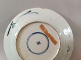 a white plate with a blue and white design on it