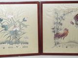 pair of framed chinese paintings of birds and flowers in a room