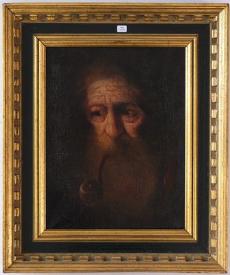 un tableau représentant un vieil homme barbu, dans un cadre doré
