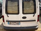 a white van that is parked in a parking lot