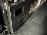 an image of a kitchen with a stove and a microwave