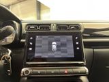 a picture of a car dashboard with a tablet on it