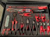 many different tools in a tool box on the floor
