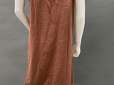the back view of a mannequin wearing a brown dress