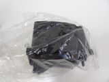 a piece of chocolate cake wrapped in plastic on a table
