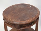 a wooden table with a leather top on a white background