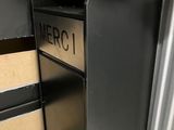 a metal mailbox with a sign on the front of it