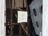 a refrigerator with a glass door and a sign on it