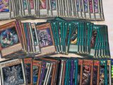 a bunch of cards are sitting on top of a bed