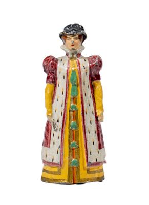 an image of a figurine of a woman in a dress and hat