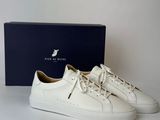 a white leather sneaker with a blue box in the background