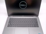 the dell laptop is open and ready to be used