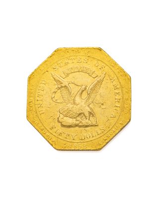l'image d'une pièce d'or ornée d'un aigle