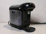 a small black coffee maker sitting on a counter
