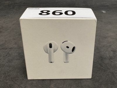 an apple airpods are sitting in a box on the floor