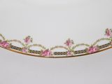 a white plate with pink flowers on it on a table