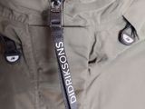 an image of a close up of a jacket with a name tag