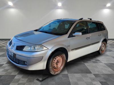 a picture of a silver car parked in a garage