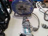a table with a lot of wires and tools on it