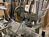 a machine that is working on a piece of wood