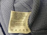 a label on a sweater that says it is not a sweater