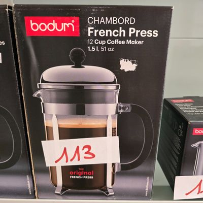 two boxes of french press coffee on display in a store