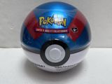 a blue and red pokemon ball on a white surface