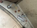 a close up of a metal object with a sign on it