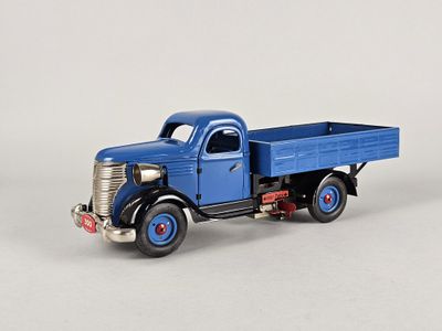 a toy truck that is blue and has red wheels