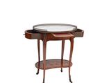 a small table with a glass top and a drawer underneath it