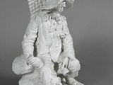 statue of a man with a basket on his back