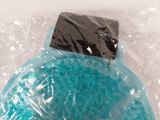 a plastic bowl with a blue substance inside of it
